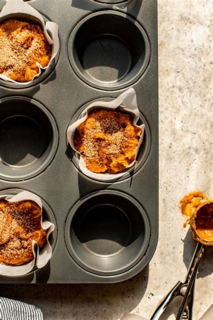 Pumpkin muffin batter in a white bowl